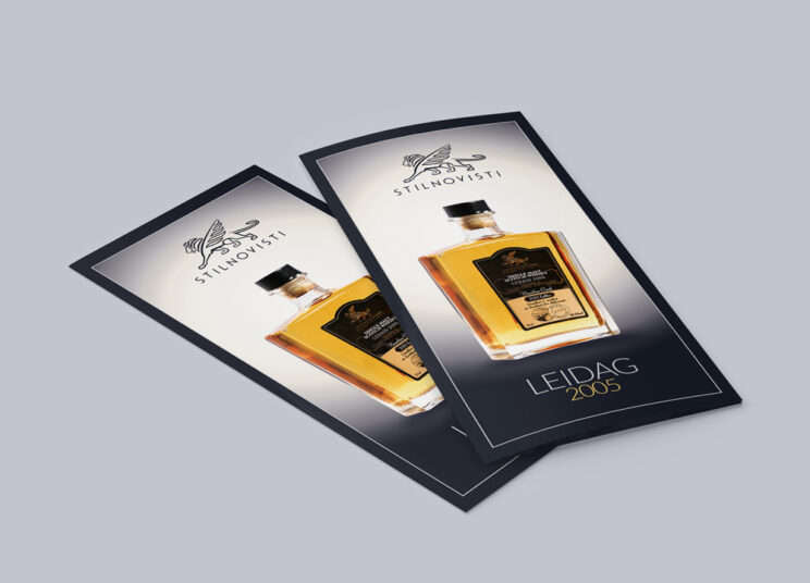 Two black and white brochures with a bottle of whisky on them, featuring a rollup design.